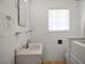 Bathroom features a vintage sink and medicine cabinet, complemented by wood look floors at 633 5Th St, Boulder City, NV 89005