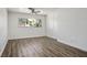 Bright bedroom with hardwood floors, built-in storage, and a large window, creating a cozy and functional space at 633 5Th St, Boulder City, NV 89005