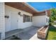 Inviting front entrance featuring a security door, well-maintained siding, and a cozy planter box at 633 5Th St, Boulder City, NV 89005