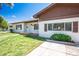 Well-maintained home with a manicured lawn, trimmed shrubs, and a brick-lined walkway leading to the front door at 633 5Th St, Boulder City, NV 89005
