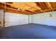 Spacious, unfinished garage with ample room for parking and storage, featuring exposed beams and painted walls at 633 5Th St, Boulder City, NV 89005