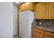 Efficient kitchen design with modern white refrigerator, ample cabinet space, and contrasting countertops at 633 5Th St, Boulder City, NV 89005