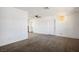 Bright living room with a vintage hanging light fixture and neutral carpet at 633 5Th St, Boulder City, NV 89005