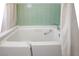 Walk-in tub with seat, shower curtain, and convenient controls at 633 5Th St, Boulder City, NV 89005