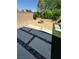 Cozy backyard featuring a firepit, desert landscaping, and a paved patio, perfect for entertaining at 6334 Orions Belt Peak St, North Las Vegas, NV 89031