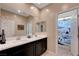 Bathroom features a double sink vanity with modern fixtures and a separate toilet area at 6334 Orions Belt Peak St, North Las Vegas, NV 89031
