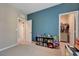 Bedroom with blue walls, an open doorway, and a playful collection of toys at 6334 Orions Belt Peak St, North Las Vegas, NV 89031