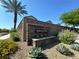 Stone entrance to Crescent Hill featuring lush landscaping and a towering palm tree at 6334 Orions Belt Peak St, North Las Vegas, NV 89031