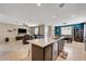 Kitchen view showcasing a marble island and eat-in breakfast area, open to the living room at 6334 Orions Belt Peak St, North Las Vegas, NV 89031