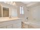 Bathroom features a vanity, a toilet, mirror, and a shower with tub combo at 7004 Powderhorn Cir, Las Vegas, NV 89128
