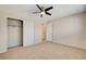 Bedroom featuring neutral carpet, closet with sliding doors, and access to additional rooms at 7004 Powderhorn Cir, Las Vegas, NV 89128