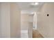 Carpeted hallway leads to various rooms, thermostat mounted on the wall at 7004 Powderhorn Cir, Las Vegas, NV 89128