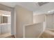 Upstairs hallway showcases plush carpeting and bathroom access at 7004 Powderhorn Cir, Las Vegas, NV 89128