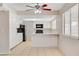 Bright eat-in kitchen with white cabinetry, modern appliances, and natural light at 7004 Powderhorn Cir, Las Vegas, NV 89128