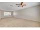 Large living room featuring soft carpet and a bright window at 7004 Powderhorn Cir, Las Vegas, NV 89128