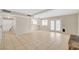 Open-concept living area with tile floors, a fireplace, and access to the backyard pool at 7004 Powderhorn Cir, Las Vegas, NV 89128