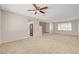 Bright living room with ceiling fan and easy access to kitchen at 7004 Powderhorn Cir, Las Vegas, NV 89128