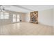 Spacious living room with tile flooring and a stone fireplace that adds charm at 7004 Powderhorn Cir, Las Vegas, NV 89128