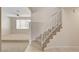 Staircase access with adjacent living room featuring large windows at 7004 Powderhorn Cir, Las Vegas, NV 89128