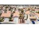 An aerial shot shows a neighborhood with a cluster of houses and palm trees at 8316 Joseph Cary Ct, Las Vegas, NV 89145