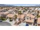 An aerial shot shows a neighborhood with a cluster of houses and palm trees at 8316 Joseph Cary Ct, Las Vegas, NV 89145