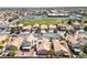 Scenic aerial view of a neighborhood featuring well-maintained homes with desert landscaping and community green spaces at 8316 Joseph Cary Ct, Las Vegas, NV 89145