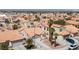 An aerial shot shows a neighborhood with a cluster of houses and palm trees at 8316 Joseph Cary Ct, Las Vegas, NV 89145