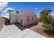 A cozy backyard includes a patio with furniture, a grill, and lush vegetation at 8316 Joseph Cary Ct, Las Vegas, NV 89145