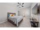 This bedroom features a ceiling fan and a wall-mounted TV at 8316 Joseph Cary Ct, Las Vegas, NV 89145