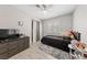 This bedroom features a ceiling fan, plush rug and dresser with TV at 8316 Joseph Cary Ct, Las Vegas, NV 89145