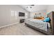 Bedroom with vaulted ceiling, TV, plantation shutters and wood-look floors at 8316 Joseph Cary Ct, Las Vegas, NV 89145
