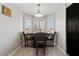 Cozy dining area with wood table, chairs and light fixture at 8316 Joseph Cary Ct, Las Vegas, NV 89145