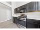 Kitchen featuring stainless steel oven and microwave, sleek countertops, and ample cabinetry at 8316 Joseph Cary Ct, Las Vegas, NV 89145