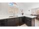 Kitchen features stainless steel sink, ample counter space, and dark wood cabinetry at 8316 Joseph Cary Ct, Las Vegas, NV 89145