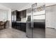 Kitchen with stainless steel refrigerator, ample storage, and wood flooring at 8316 Joseph Cary Ct, Las Vegas, NV 89145