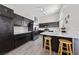 Modern kitchen with white countertops, stainless steel appliances, and wood flooring at 8316 Joseph Cary Ct, Las Vegas, NV 89145