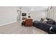 Bright living room features a fireplace, neutral paint, ceiling fan and modern furnishings at 8316 Joseph Cary Ct, Las Vegas, NV 89145