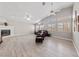 Spacious living room with vaulted ceilings, fireplace, and wood-look floors at 8316 Joseph Cary Ct, Las Vegas, NV 89145
