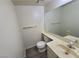 Half-bathroom featuring a large mirror, vanity, and neutral color palette at 854 Stainglass Ln, Las Vegas, NV 89110