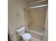 Bathroom featuring a shower-tub combo, toilet, and neutral color palette at 854 Stainglass Ln, Las Vegas, NV 89110