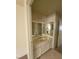 Bathroom featuring a large mirror, vanity, and neutral color palette at 854 Stainglass Ln, Las Vegas, NV 89110