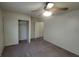 This is a standard bedroom with carpet flooring, a ceiling fan, and closet storage at 854 Stainglass Ln, Las Vegas, NV 89110