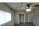 Standard bedroom featuring a window with blinds, carpet flooring and built in closet storage at 854 Stainglass Ln, Las Vegas, NV 89110