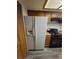 Practical kitchen with a refrigerator, gas range, and ample storage space at 854 Stainglass Ln, Las Vegas, NV 89110