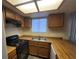 Functional kitchen featuring wood countertops and essential appliances at 854 Stainglass Ln, Las Vegas, NV 89110