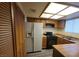 Efficient kitchen layout with ample cabinet space and a full-size refrigerator at 854 Stainglass Ln, Las Vegas, NV 89110
