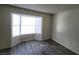 This is a living room featuring a bay window and wood floors at 854 Stainglass Ln, Las Vegas, NV 89110