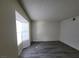 Spacious living room features sleek floors, a bay window and neutral paint at 854 Stainglass Ln, Las Vegas, NV 89110