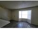 This is a living room featuring a bay window and wood floors at 854 Stainglass Ln, Las Vegas, NV 89110