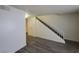 Open-concept living room with staircase, sleek flooring, and fresh neutral paint at 854 Stainglass Ln, Las Vegas, NV 89110